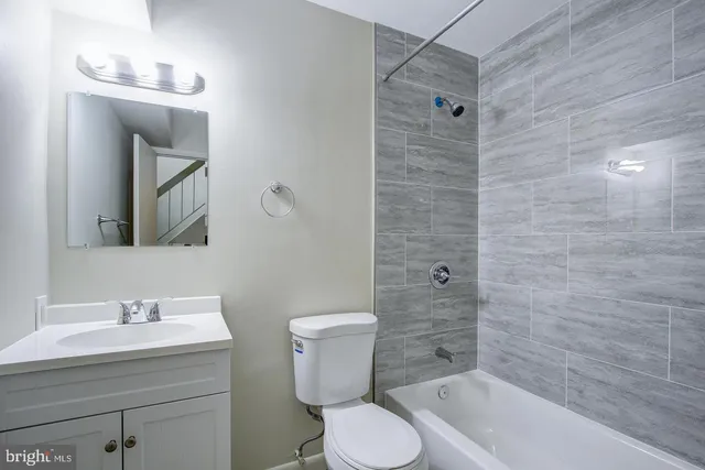 a view of wooden floor and windows in a room