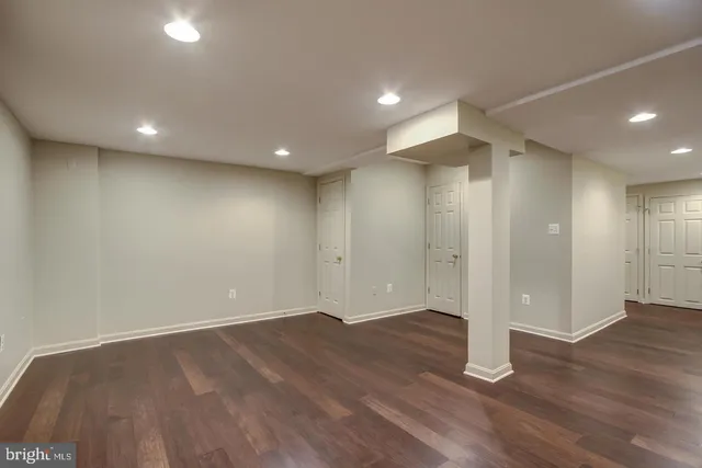 a front view of a house with plants