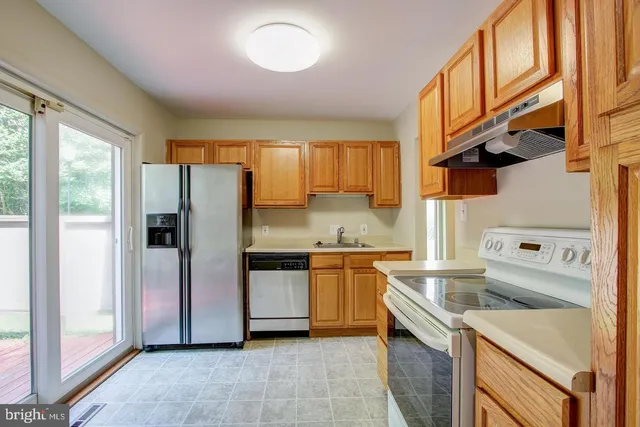 a kitchen with a stove and a cabinet