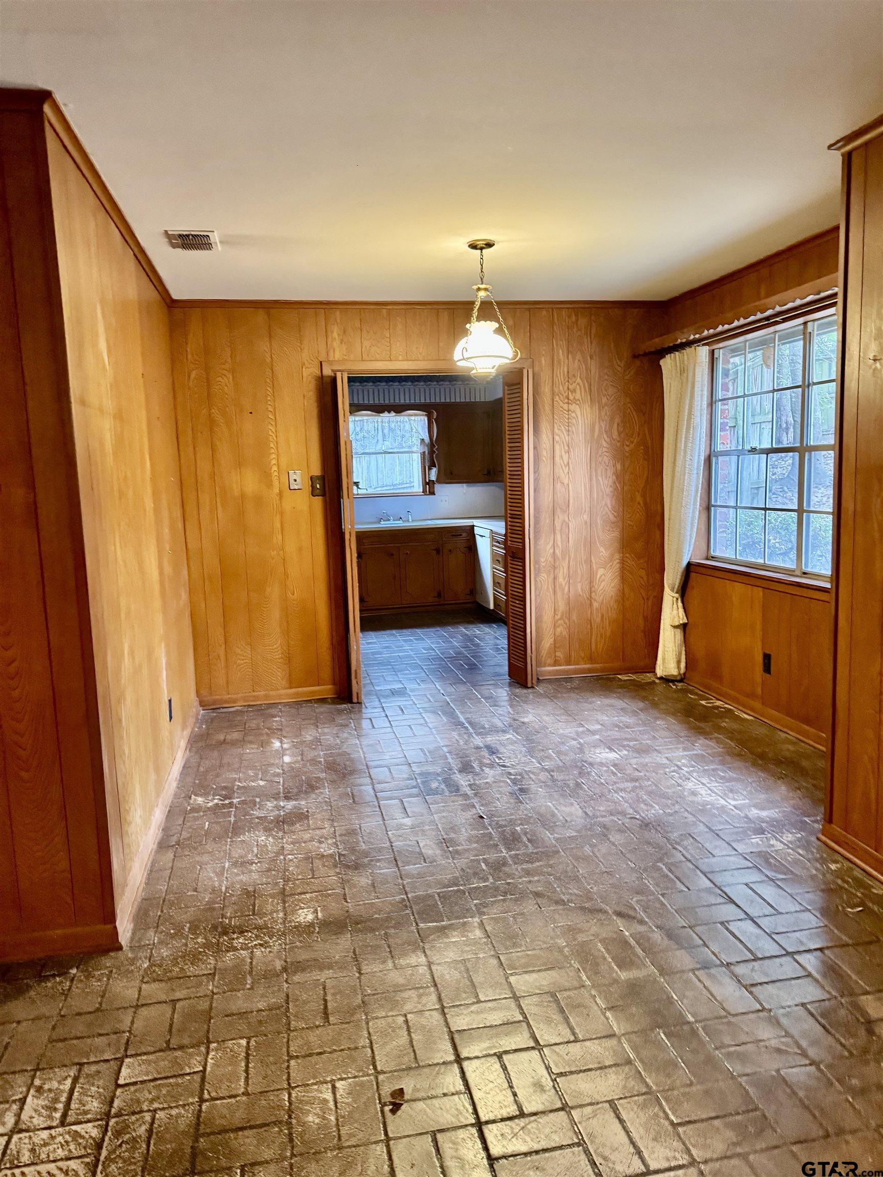 1113 East Amherst Drive Tyler, TX 75701 - Photo 4 of 7 a view of a room with wooden floor and furniture