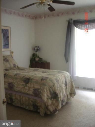 3805 Houcks Road Monkton, MD 21111 - Photo 13 of 29 a bed sitting in a bedroom next to a window