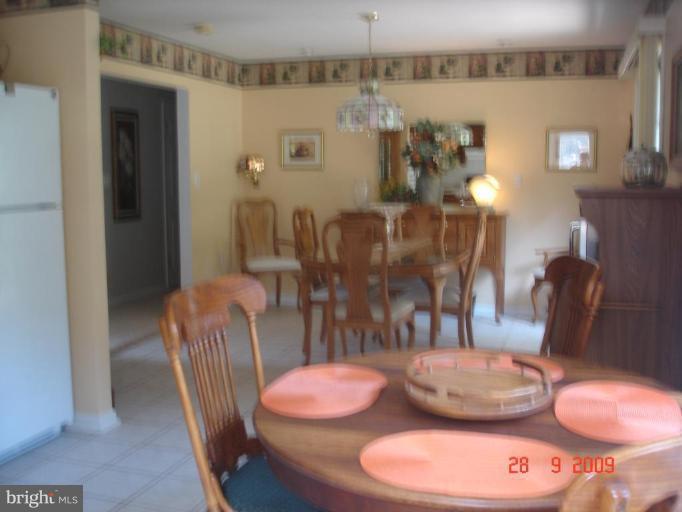 3805 Houcks Road Monkton, MD 21111 - Photo 17 of 29 a dining room with furniture and wooden floor
