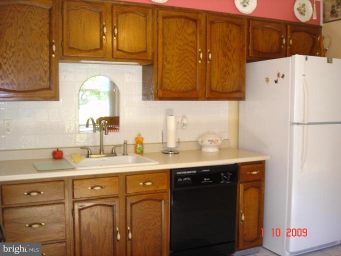 3805 Houcks Road Monkton, MD 21111 - Photo 18 of 29 a kitchen with a sink a refrigerator and cabinets
