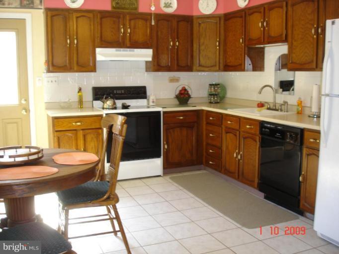 3805 Houcks Road Monkton, MD 21111 - Photo 19 of 29 a kitchen with a sink cabinets and window