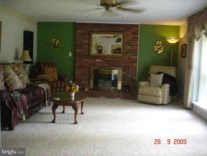3805 Houcks Road Monkton, MD 21111 - Photo 3 of 29 a living room with furniture and a fireplace