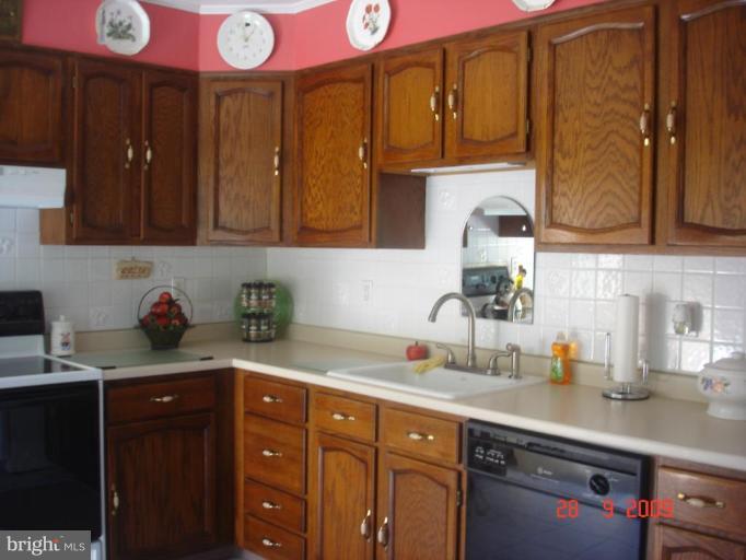 3805 Houcks Road Monkton, MD 21111 - Photo 26 of 29 a kitchen with stainless steel appliances granite countertop a sink and cabinets
