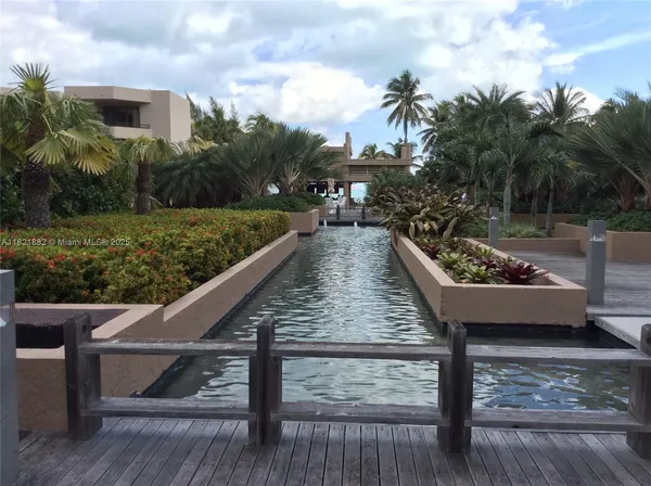 a view of a swimming pool with a garden and plants