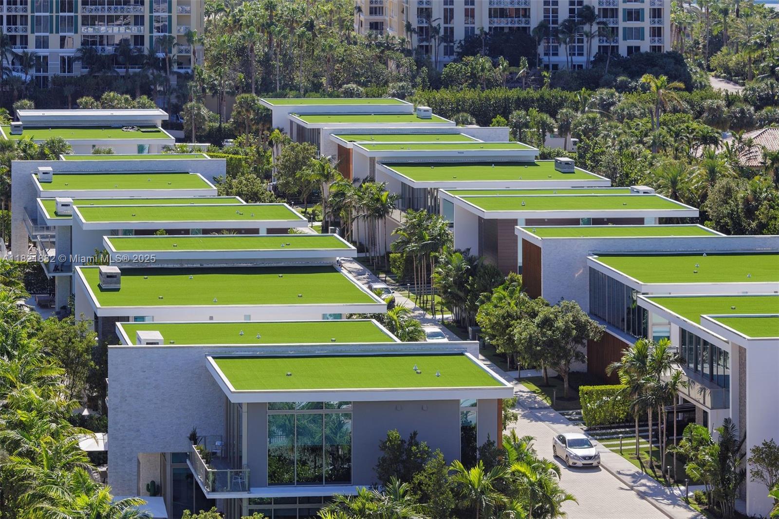 201 Crandon Boulevard, Unit 439 Key Biscayne, FL 33149 - Photo 22 of 24 a view of a swimming pool with a garden and plants