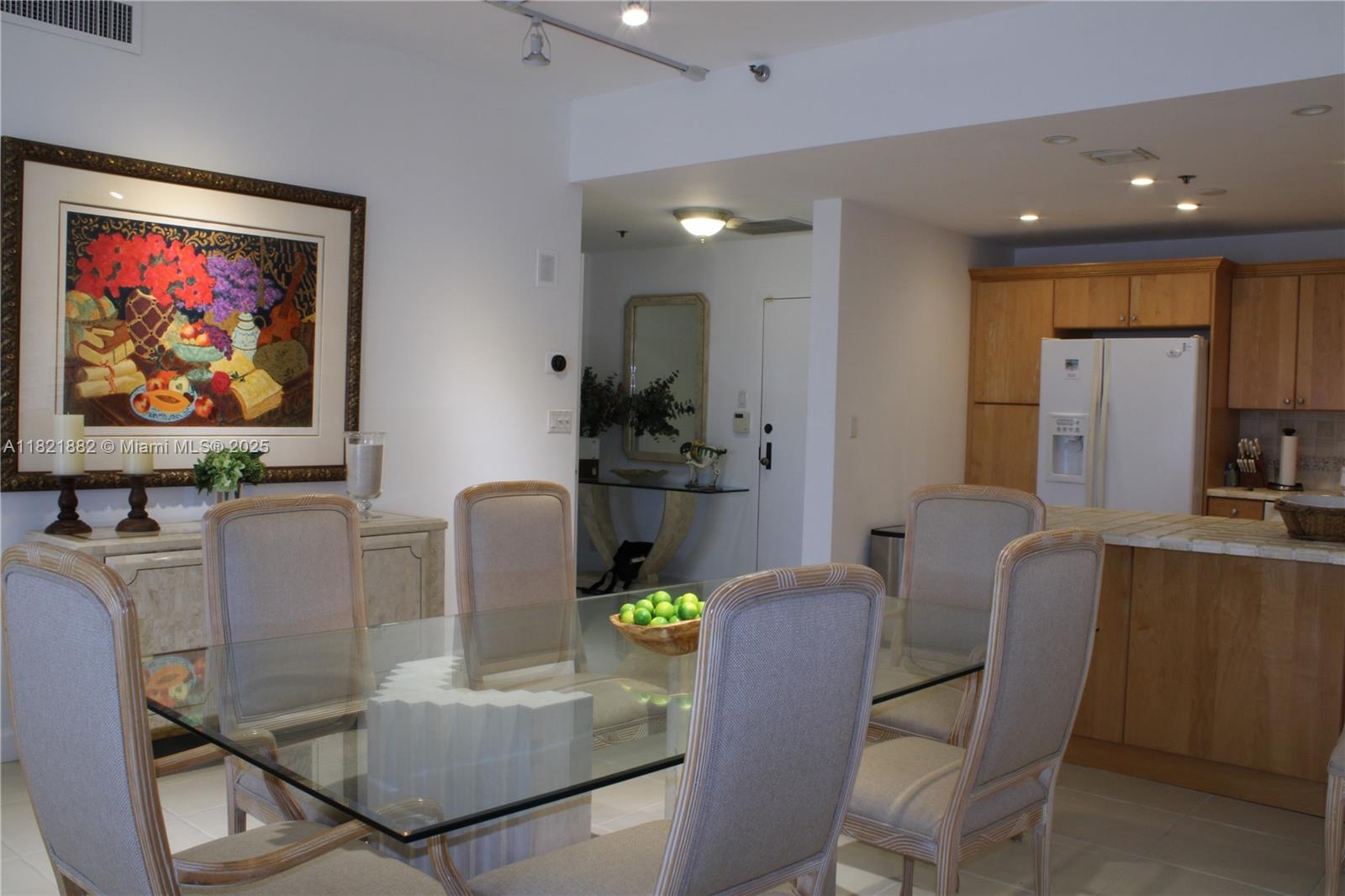 201 Crandon Boulevard, Unit 439 Key Biscayne, FL 33149 - Photo 4 of 24 a dining room with furniture and window