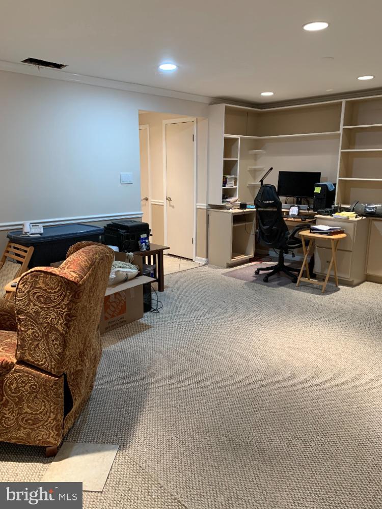 1607 Ingram Terrace Silver Spring, MD 20906 - Photo 32 of 39 Lower Level Rec Room w/built-in desk & shelving