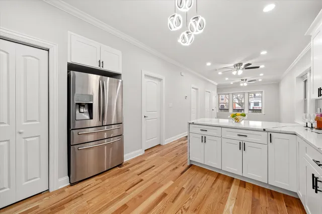 a kitchen with a refrigerator and a sink