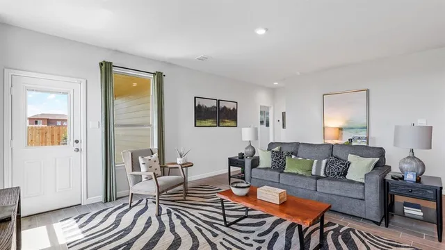 a dining room with furniture and wooden floor