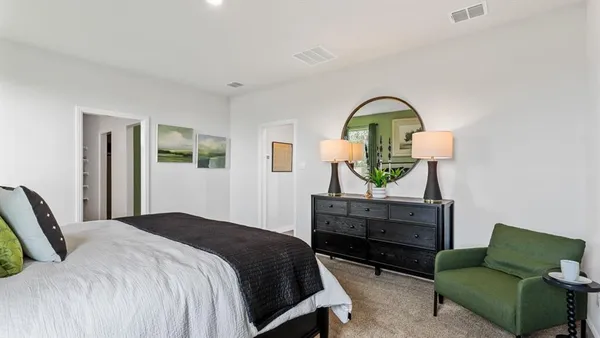 a bedroom with bed and a window