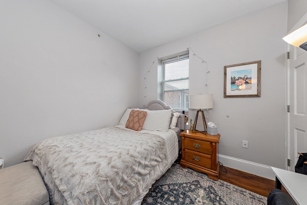 16 Sewall Street Boston, MA 02120 - Photo 11 of 42 a bedroom with a bed and wooden floor