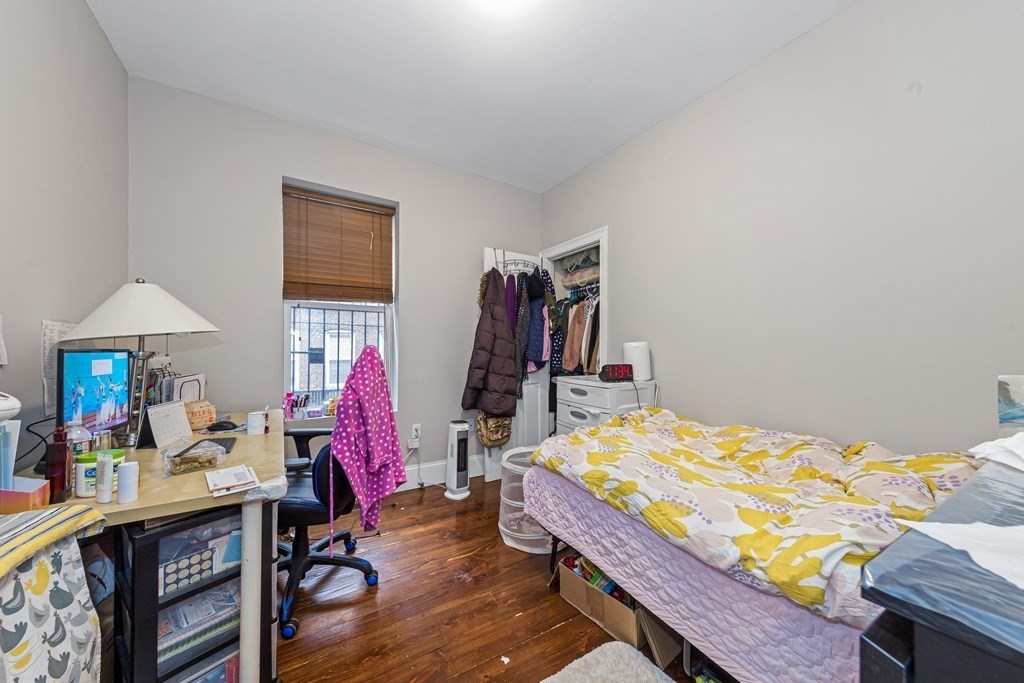 16 Sewall Street Boston, MA 02120 - Photo 19 of 42 a bed room with a bed and a desk