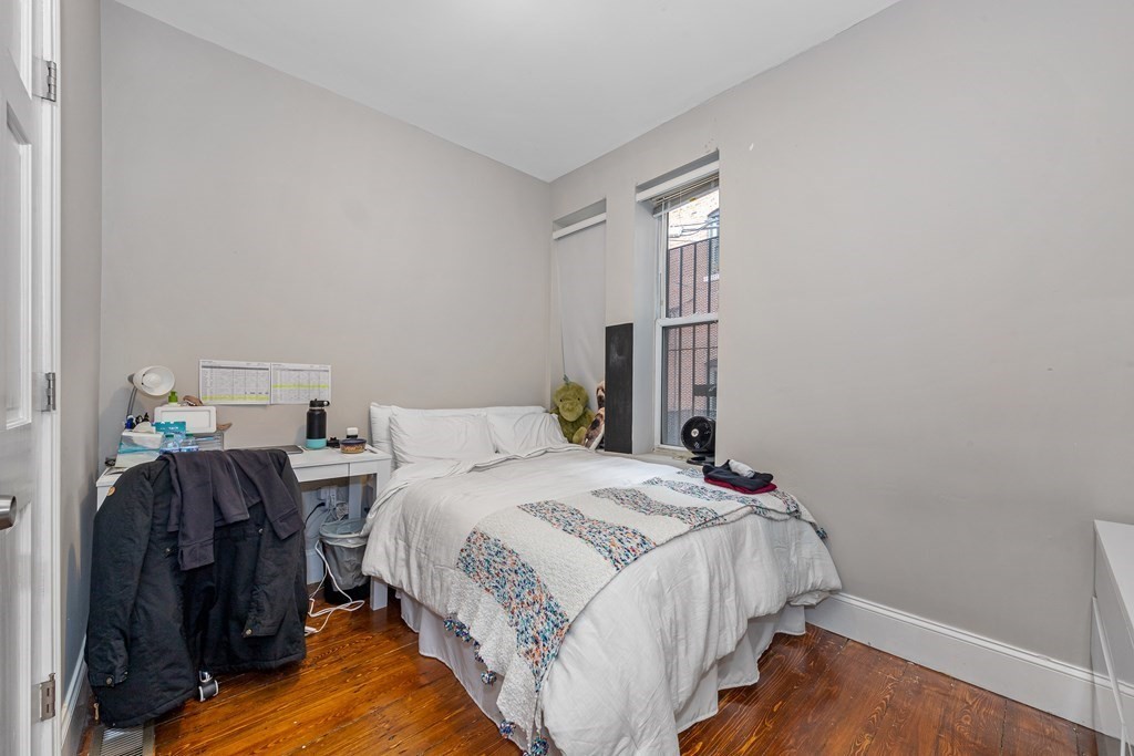 16 Sewall Street Boston, MA 02120 - Photo 26 of 42 a bedroom with a bed and a window