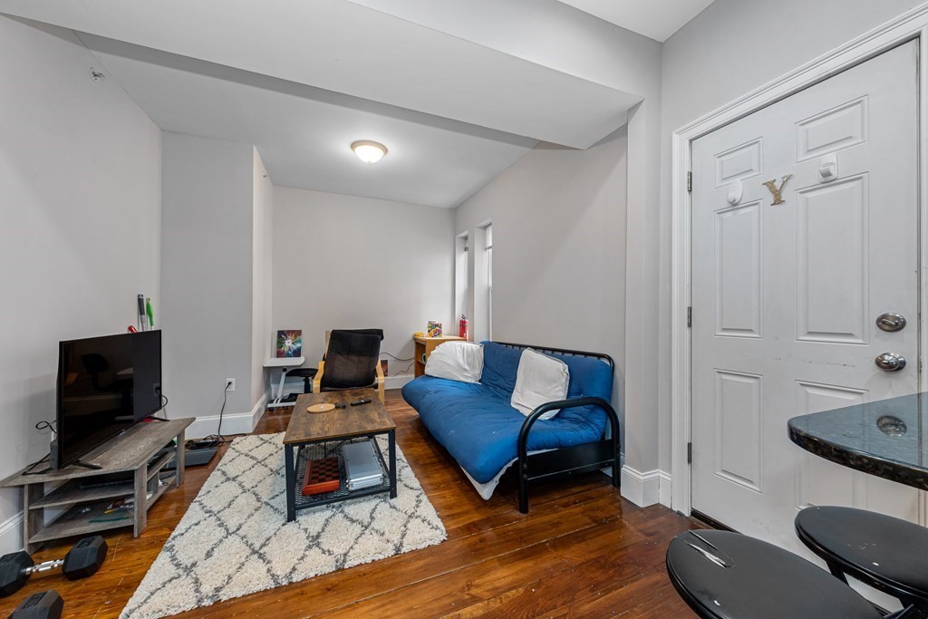 16 Sewall Street Boston, MA 02120 - Photo 30 of 42 a living room with furniture and a flat screen tv