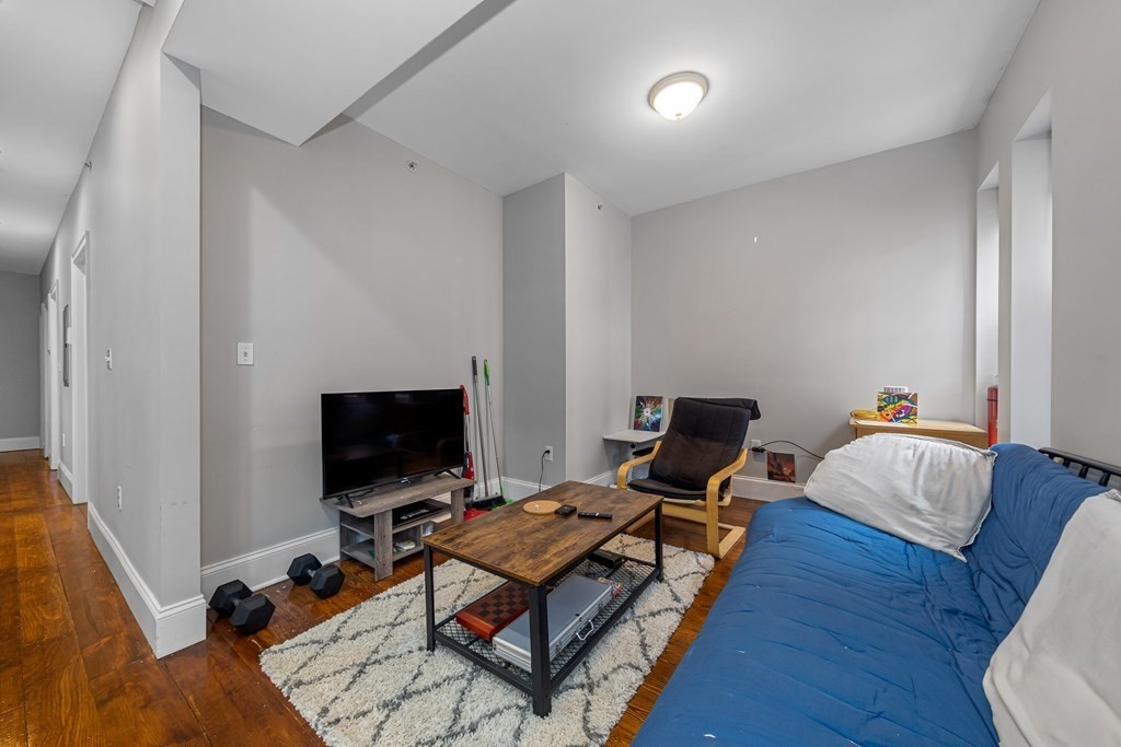 16 Sewall Street Boston, MA 02120 - Photo 31 of 42 a living room with furniture flat screen tv and a lamp