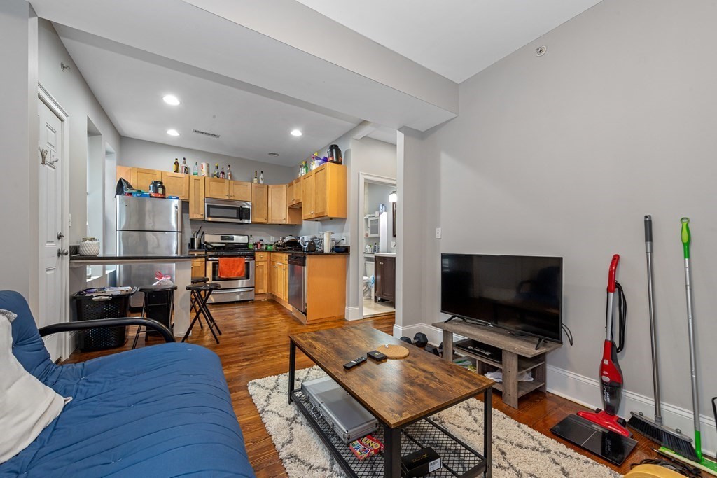 16 Sewall Street Boston, MA 02120 - Photo 32 of 42 a living room with furniture and a flat screen tv