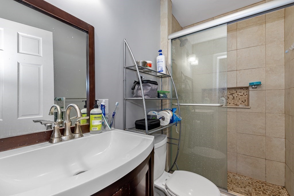 16 Sewall Street Boston, MA 02120 - Photo 34 of 42 a bathroom with a sink a toilet and shower