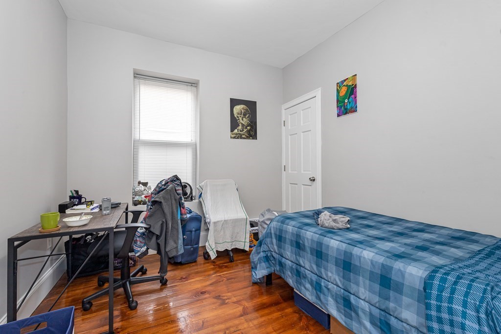 16 Sewall Street Boston, MA 02120 - Photo 35 of 42 a bedroom with bed and a window