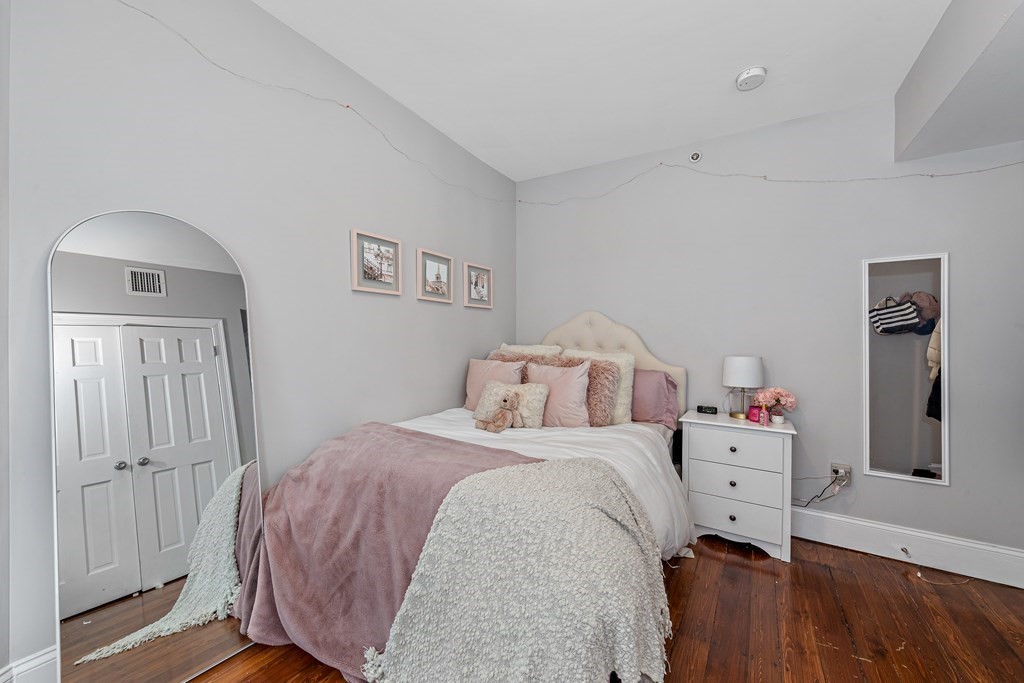 16 Sewall Street Boston, MA 02120 - Photo 40 of 42 a bedroom with a bed and wooden floor
