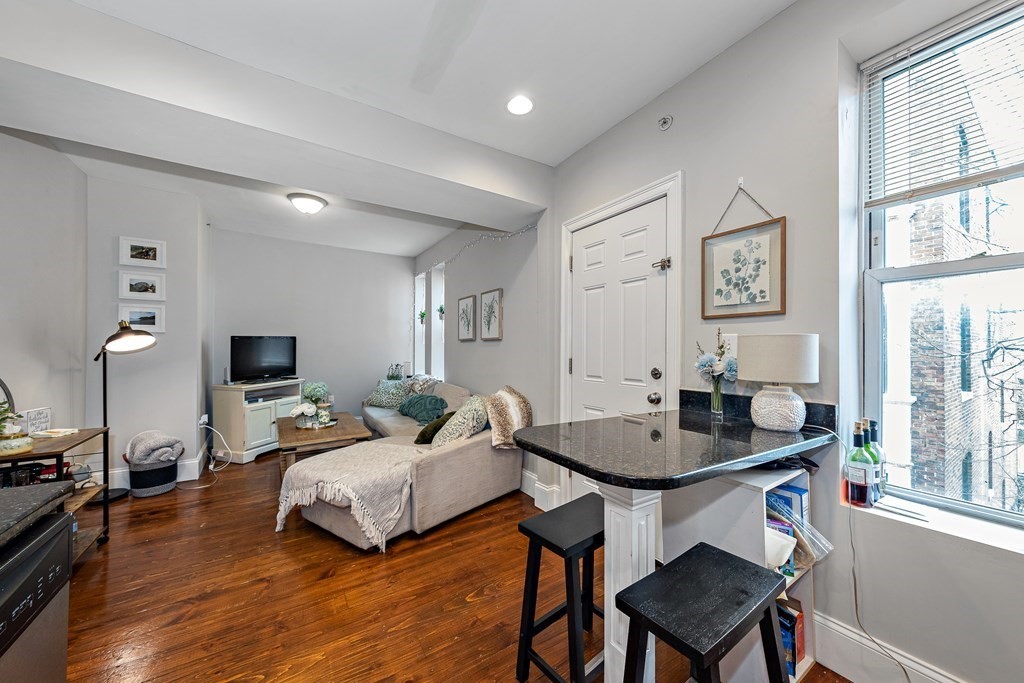 16 Sewall Street Boston, MA 02120 - Photo 4 of 42 a living room with furniture a window and a flat screen tv