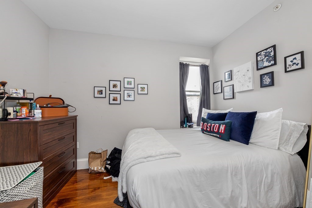 16 Sewall Street Boston, MA 02120 - Photo 41 of 42 a bedroom with a bed and wooden floor
