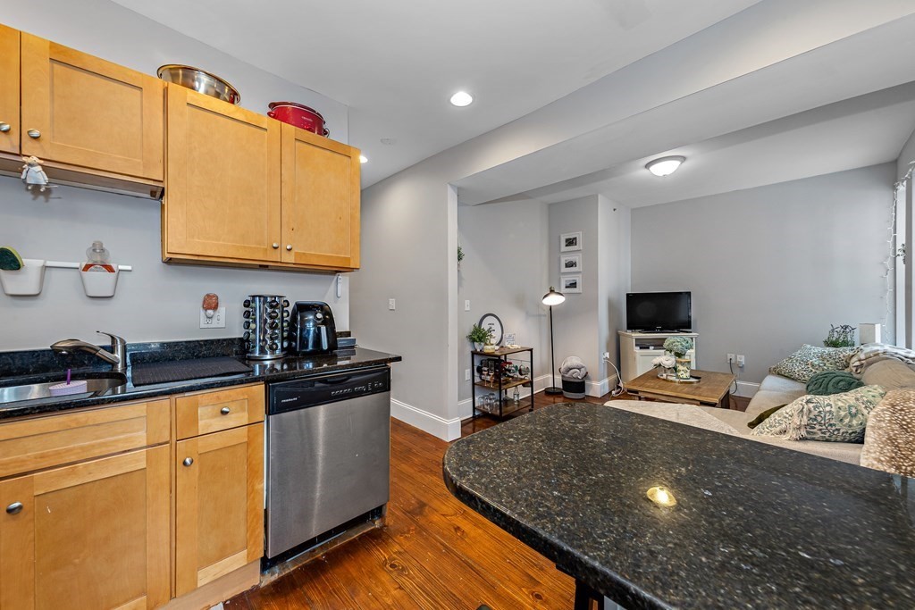 16 Sewall Street Boston, MA 02120 - Photo 10 of 42 a kitchen with sink a refrigerator and cabinets