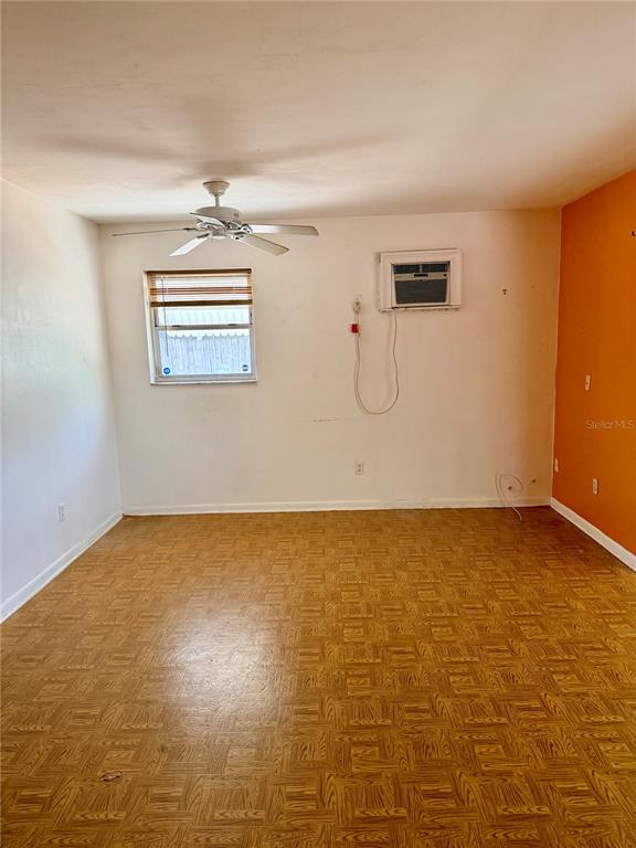 7055 Merrick Lane Spring Hill, FL 34606 - Photo 10 of 17 a view of a room with projector and screen