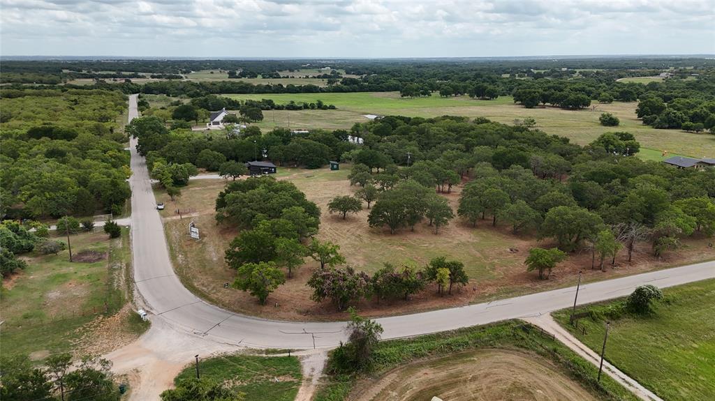 1895 Sunflower Road, Unit LOT 2 Paradise, TX 76073 - Photo 11 of 25 an aerial view of a houses with outdoor space and trees all around