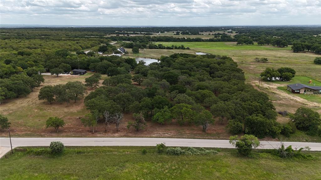 1895 Sunflower Road, Unit LOT 2 Paradise, TX 76073 - Photo 9 of 25 an aerial view of field with trees