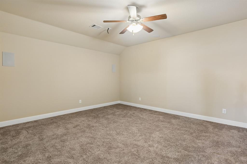 537 Hunt Farms Road Fate, TX 75189 - Photo 26 of 36 Vaulted ceiling with an attached ceiling fan and light fixture