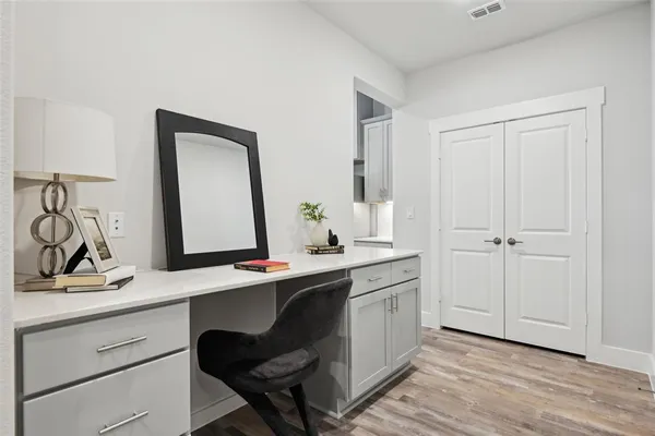 a room with a sink and a mirror