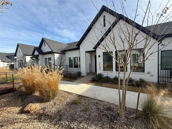 a house view with a garden space