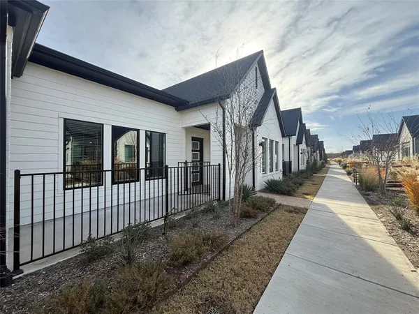 a street sign on a brick wall