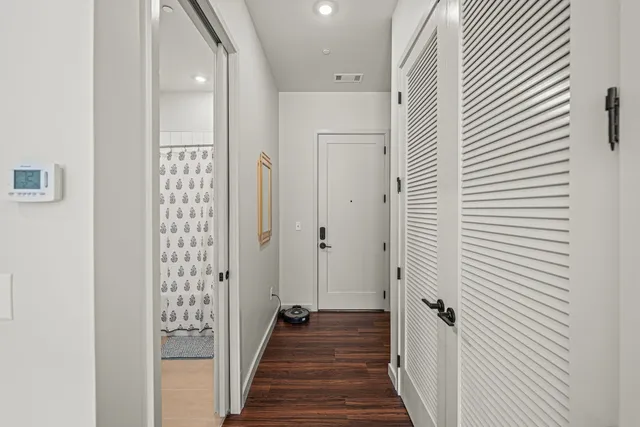 a view of a bathroom from the hallway