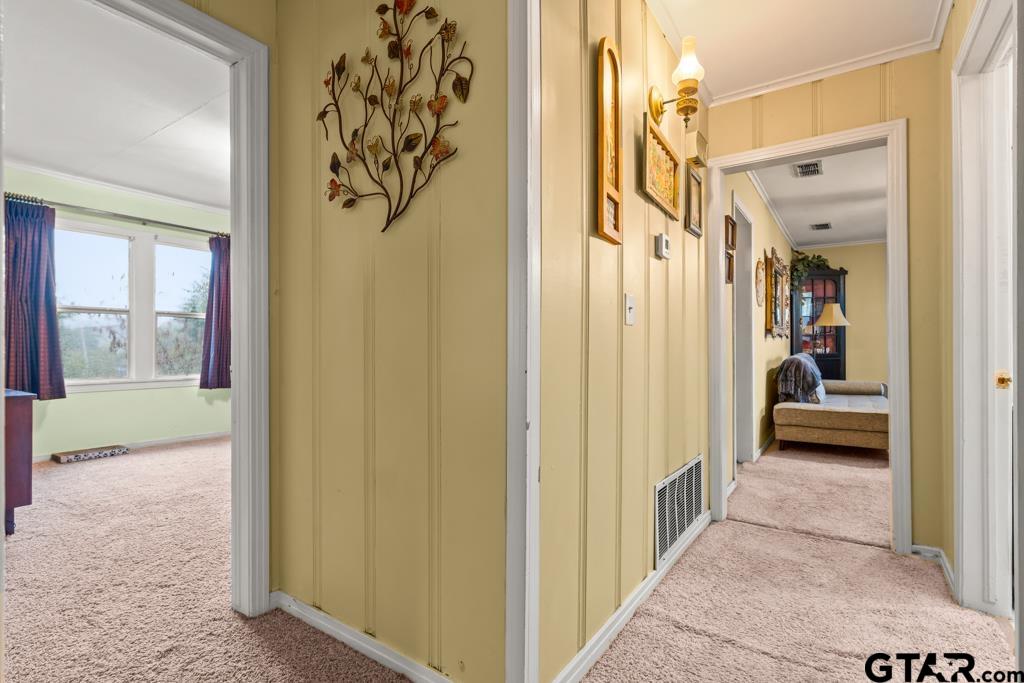 2131 Tryon Road Longview, TX 75601 - Photo 14 of 39 a view of a hallway with a livingroom and furniture