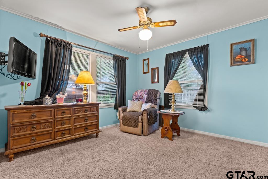 2131 Tryon Road Longview, TX 75601 - Photo 21 of 39 a living room with furniture and a flat screen tv