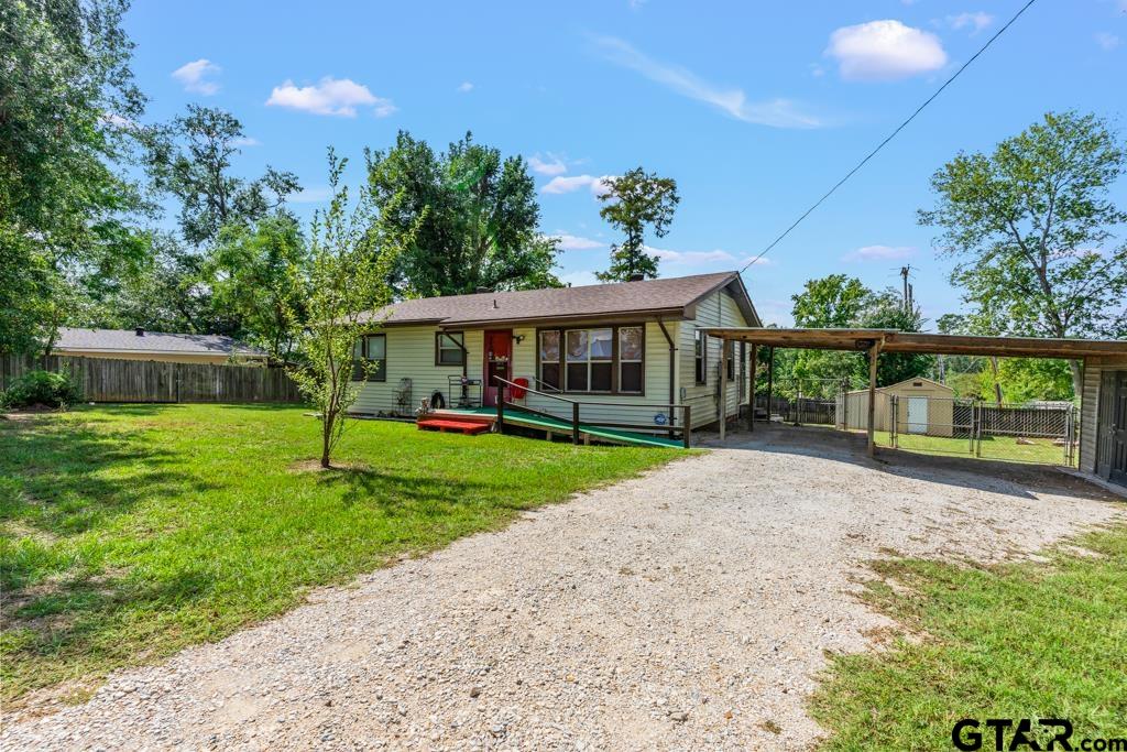 2131 Tryon Road Longview, TX 75601 - Photo 22 of 39 a view of a house with a yard