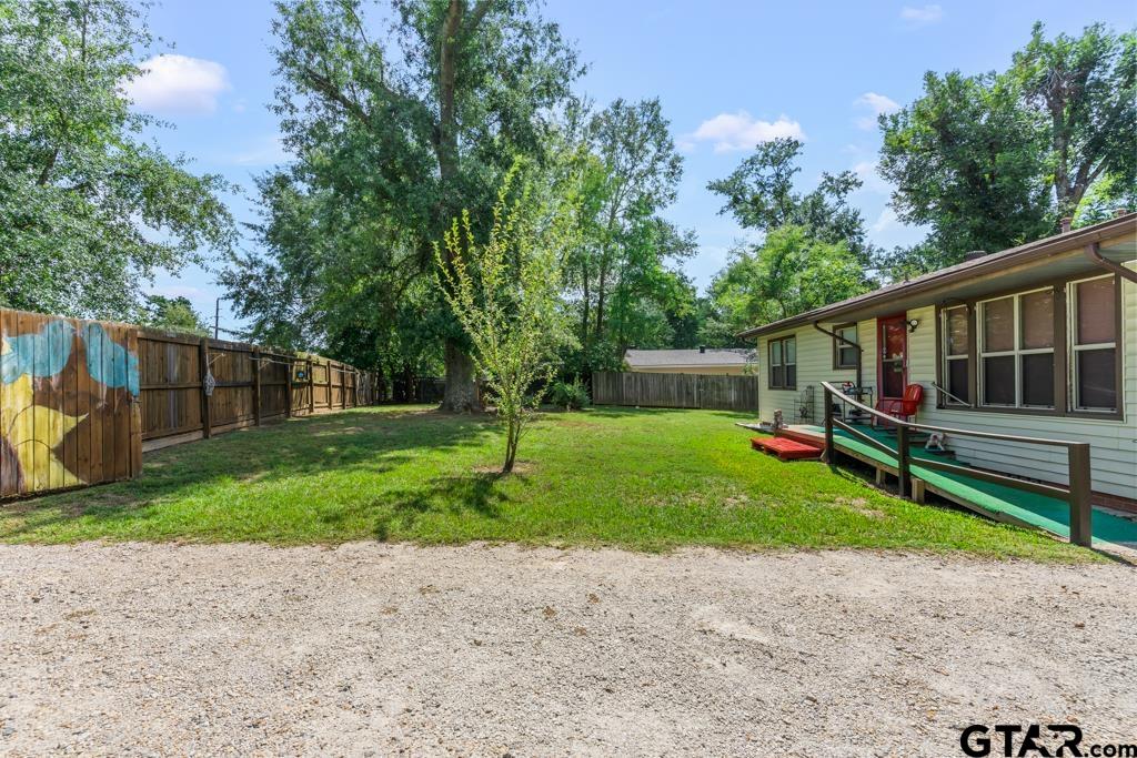 2131 Tryon Road Longview, TX 75601 - Photo 23 of 39 a view of a house with backyard and a tree