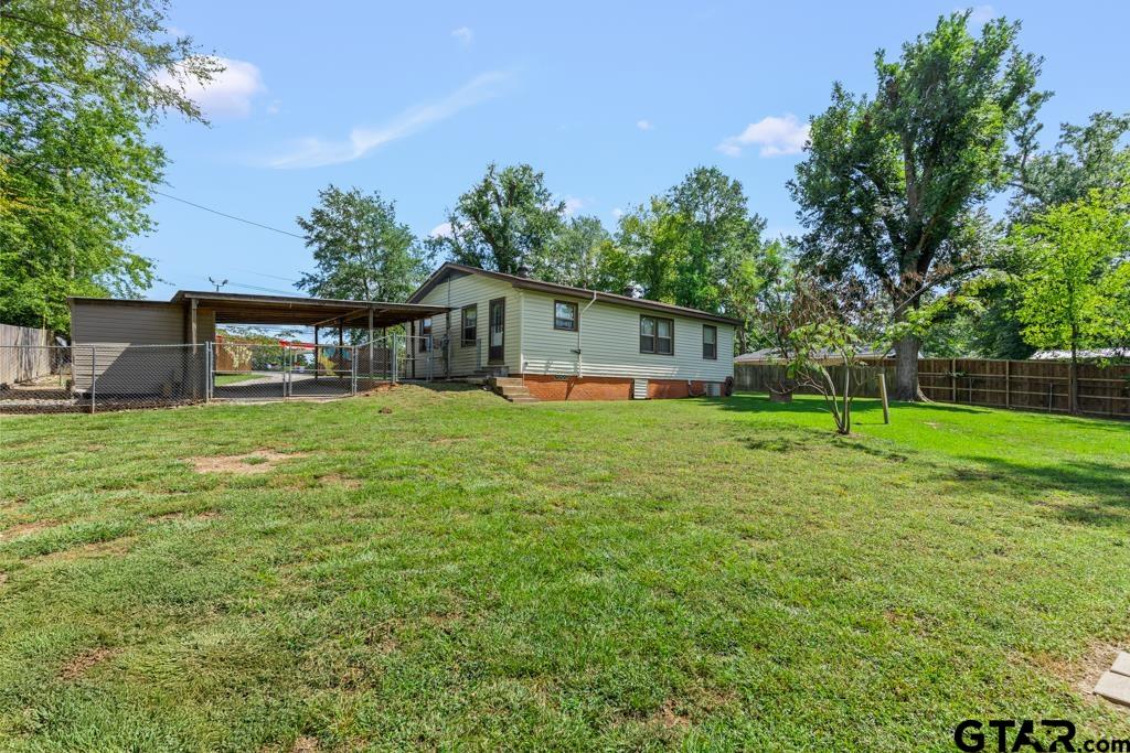 2131 Tryon Road Longview, TX 75601 - Photo 24 of 39 a view of a house with a yard porch and sitting area
