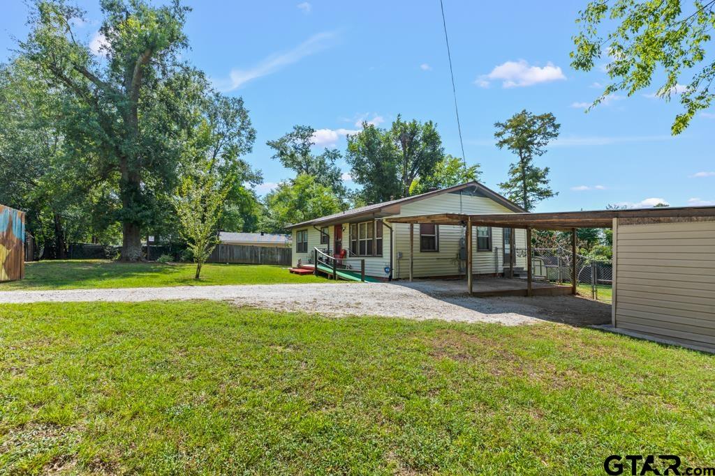 2131 Tryon Road Longview, TX 75601 - Photo 31 of 39 a view of a house with a yard