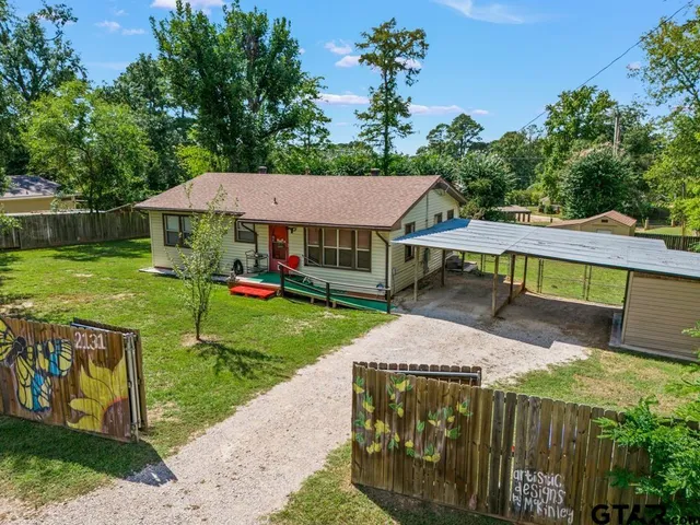an aerial view of a house with a garden
