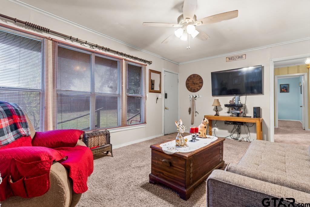 2131 Tryon Road Longview, TX 75601 - Photo 4 of 39 a living room with furniture and a flat screen tv