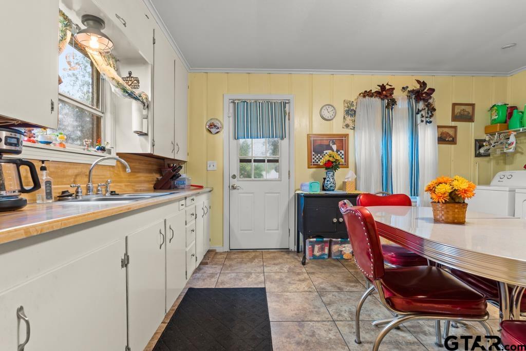 2131 Tryon Road Longview, TX 75601 - Photo 10 of 39 a kitchen with stainless steel appliances granite countertop a sink and cabinets