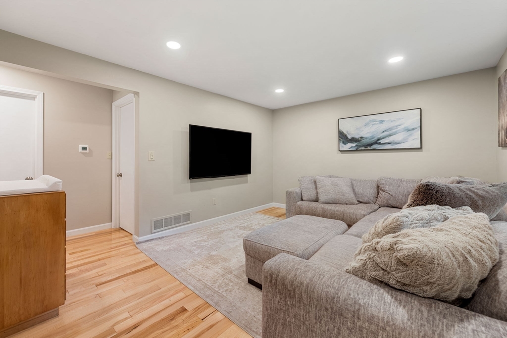 25 Holly Drive Gardner, MA 01440 - Photo 14 of 32 a living room with furniture and a flat screen tv