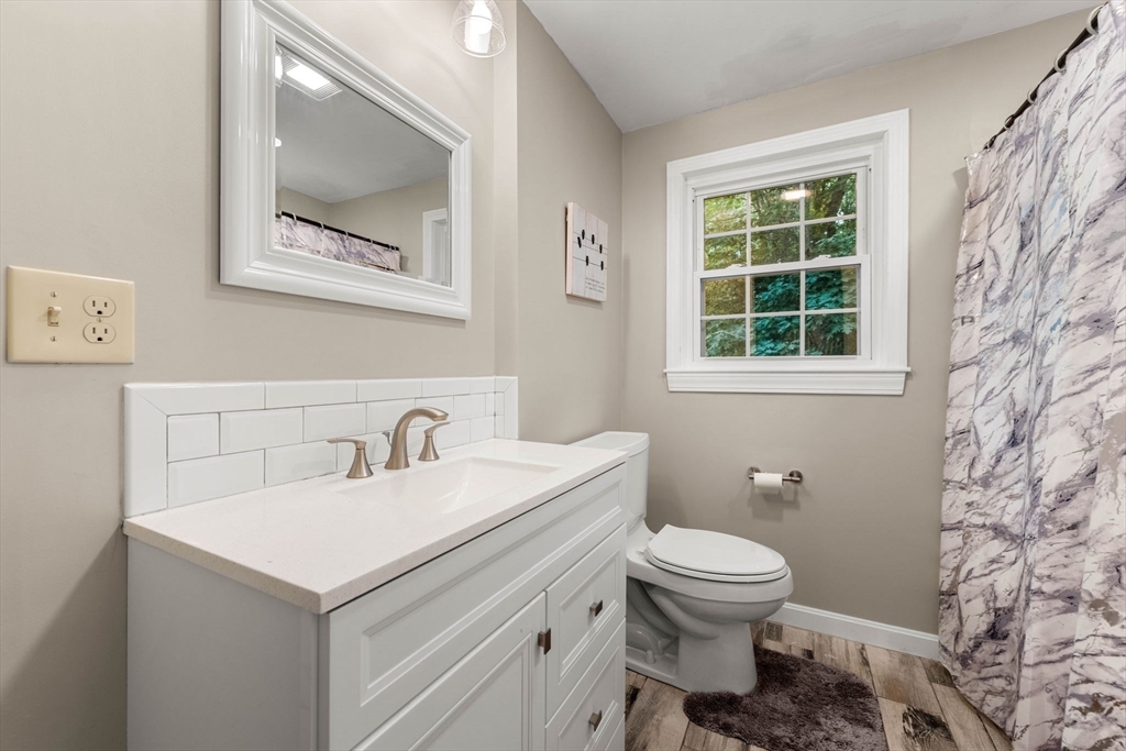 25 Holly Drive Gardner, MA 01440 - Photo 19 of 32 a bathroom with a toilet sink and a mirror