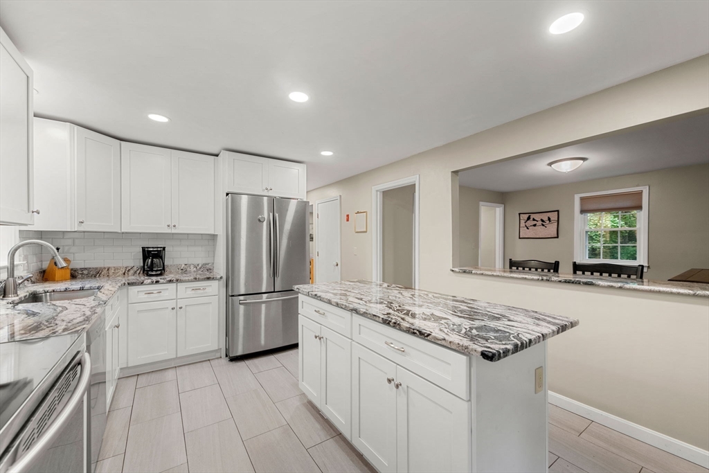 25 Holly Drive Gardner, MA 01440 - Photo 6 of 32 a kitchen with a sink stove and refrigerator