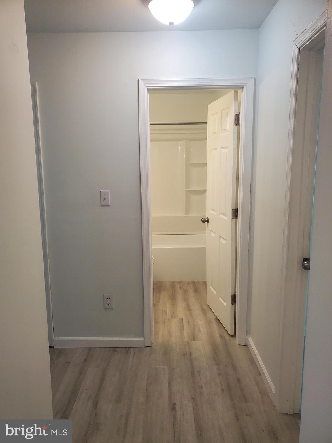 112 Holmes Street Dover, DE 19901 - Photo 11 of 24 a view of a room with wooden floor and a sink